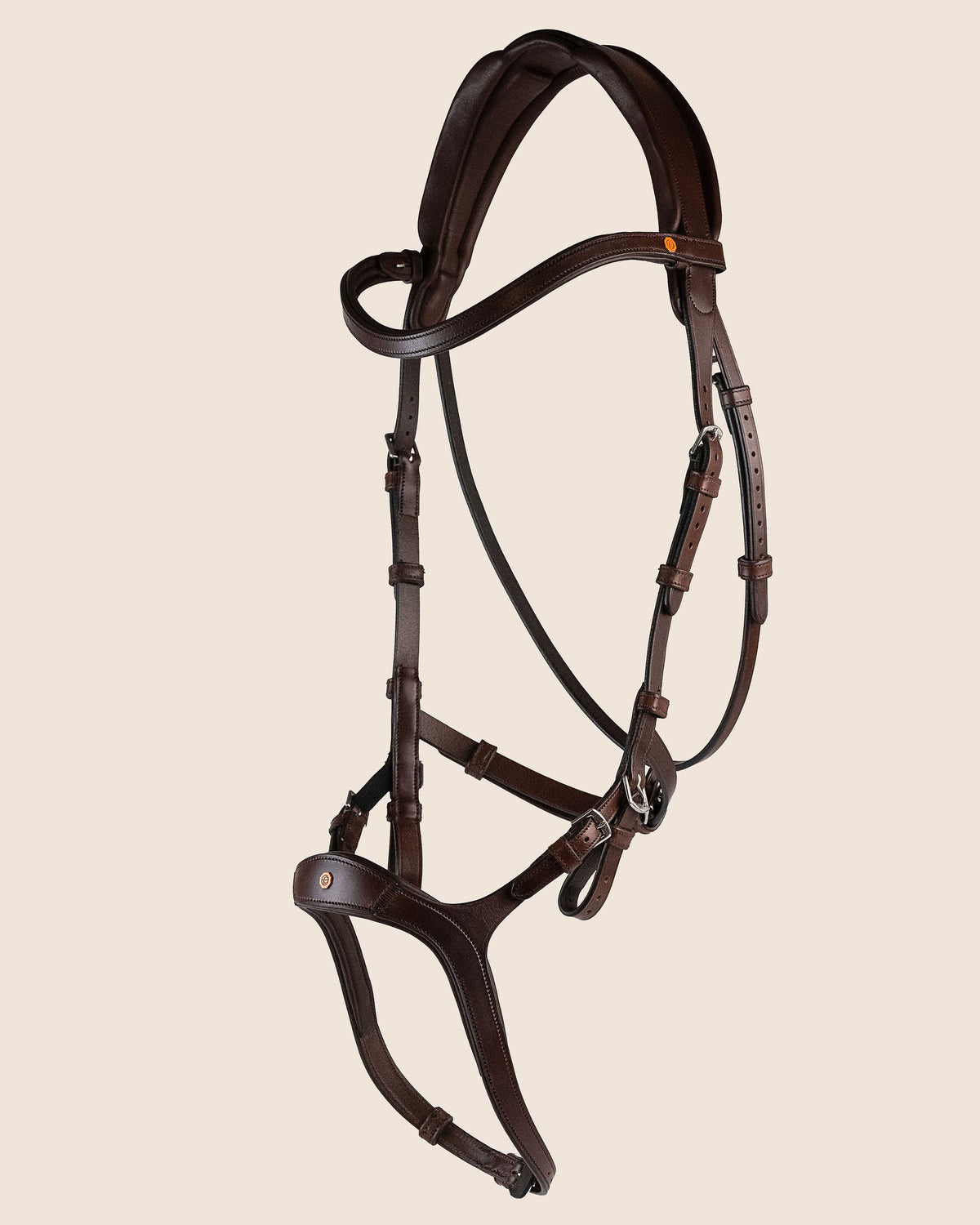 Brown leather horse bridle on a beige background