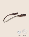 Load image into Gallery viewer, Brown leather strap with crystal embellishments on a beige background
