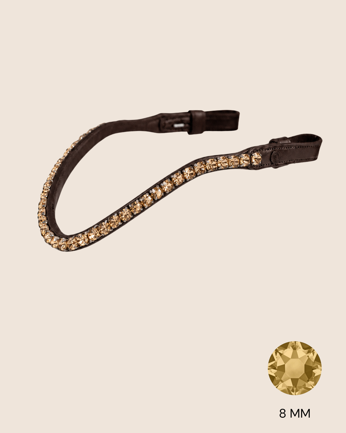 Brown leather strap with gold rhinestones on a beige background