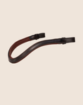 Load image into Gallery viewer, Brown leather strap on a beige background
