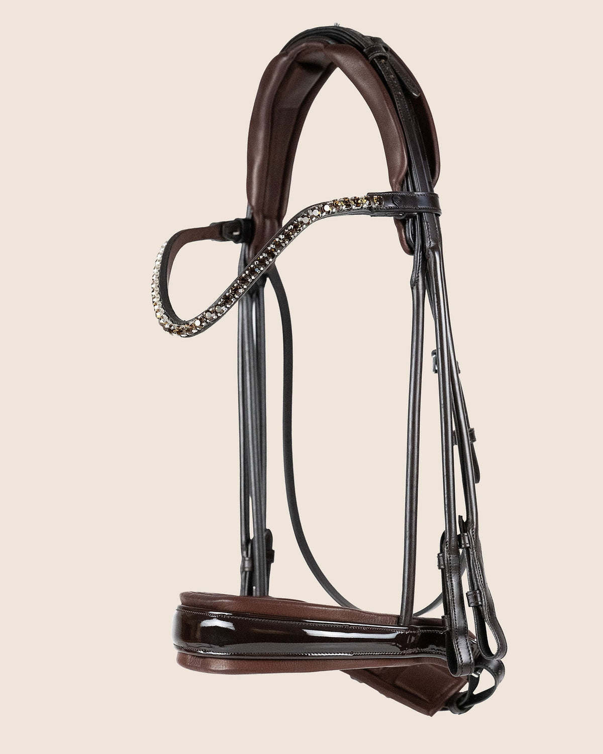 Brown horse bridle with decorative elements on a beige background