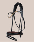 Load image into Gallery viewer, Black leather bridle with decorative elements on a beige background
