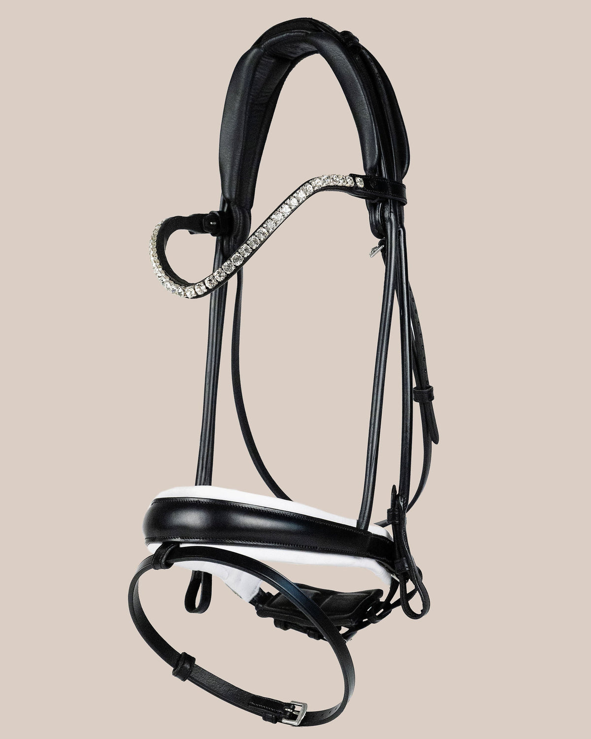 Black horse bridle with decorative elements on a beige background